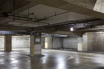 Parking garage underground interior, neon lights in dark