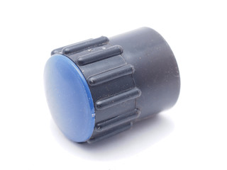 cap from the faucet on a white background