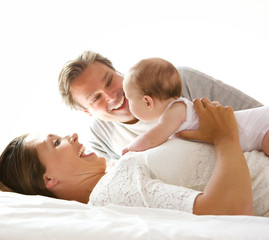 Happy mother and father with newborn child