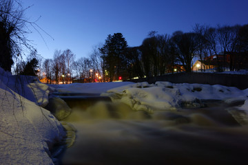 Vanhankaupungin koski rapids in a wintery evening after sunset