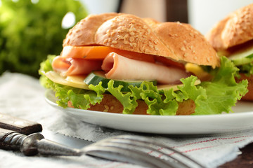 Sandwich with fresh lettuce, tomato, ham and cheese