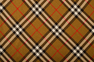 Tartan pattern.Brown plaid print as background.Asymmetric square