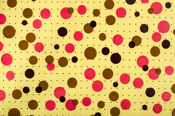 Retro dots pattern.Pink brown dots print on yellow background.
