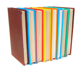 Multi-coloured books. On white background.