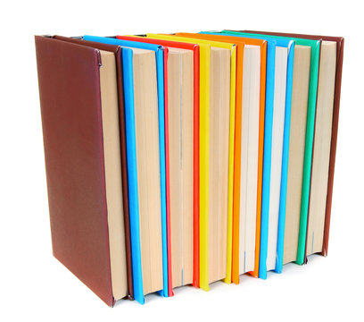 Multi-coloured books. On white background.