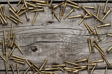 yellow screws on the wooden table