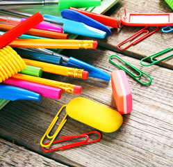School tools. On wooden background.