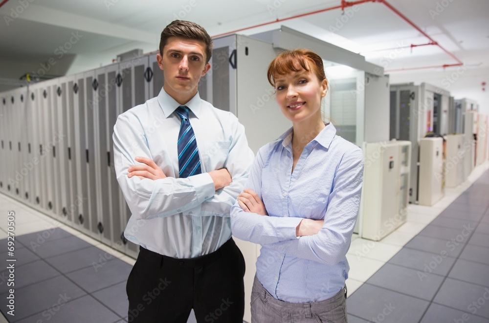 Poster confident data technicians looking at camera