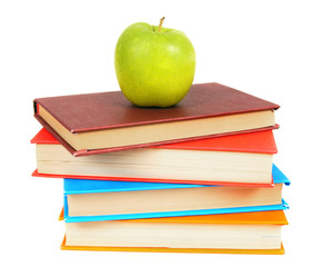 Books and an apple. On white background.