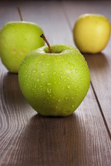 fresh green apples on the table