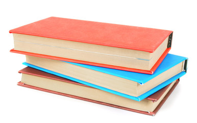Multi-coloured books. On white background.