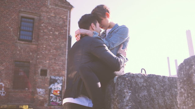 Couple sharing an intimate moment in urban area