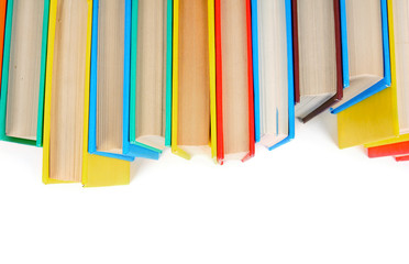 Multi-coloured books. On white background.