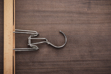 clothing hanger on brown table