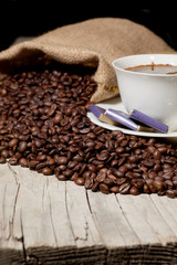 coffee beans and old brass cup