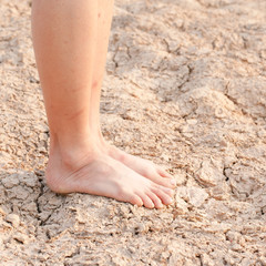 naked Feet on dry Soil