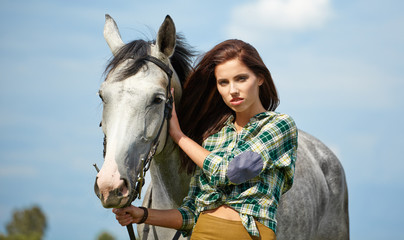 Obraz premium Woman with a white horse