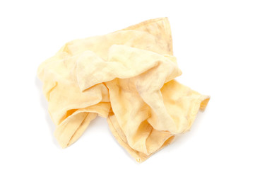Yellow cleaning rag isolated on white.