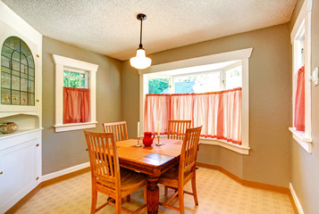 Dining room in old house with carved wood table