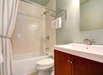 Simple bathroom interior with tile wall trim