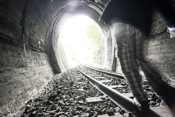 Child walking on railway road