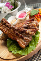 Pork ribs on wooden plate