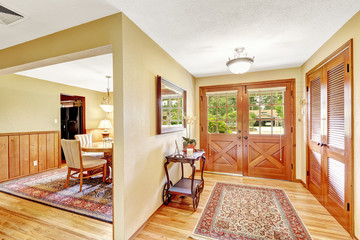 House hallway with carved wood entrance door