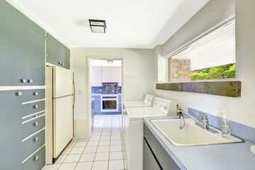 Laundry room with built-in cabinets