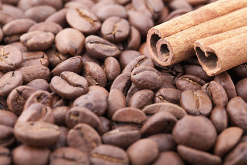 Roasted coffee beans background with cinnamon