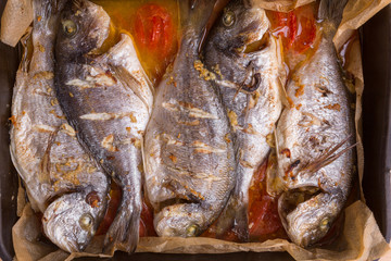 seabass fish on a baking sheet