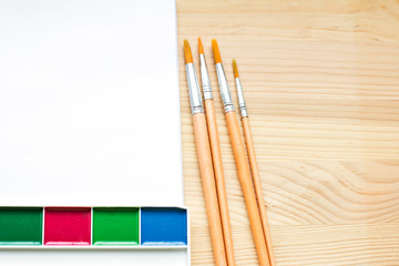paints, brushes and paper