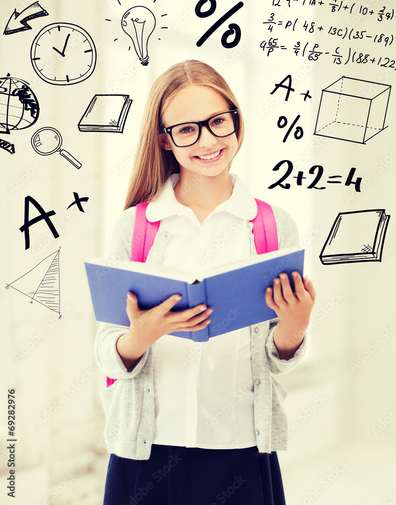 Wall mural girl reading book at school