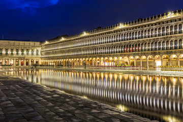 Fototapeta premium San Marco square with reflection on water at night, Venice.