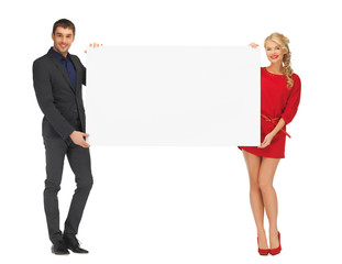 couple holding big blank white board
