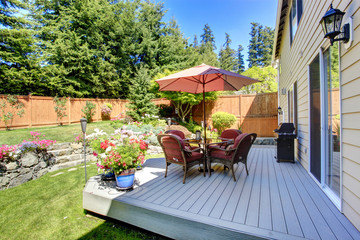 Backyard patio area with landscape