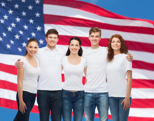 group of smiling teenagers in white blank t-shirts