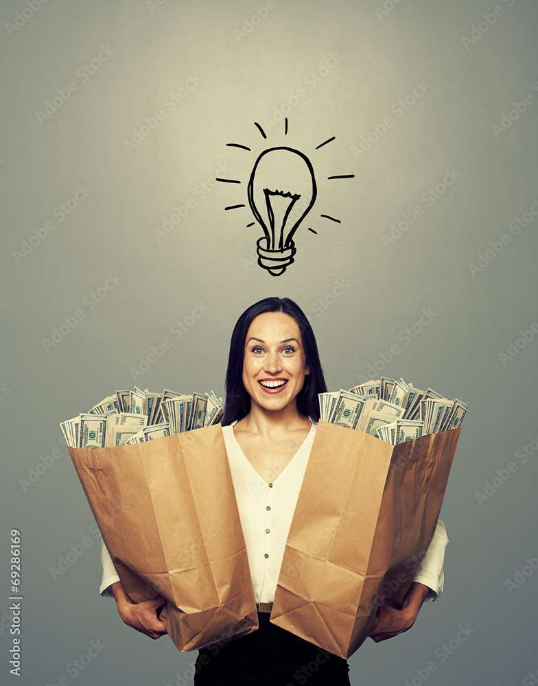 Wall mural businesswoman with drawing light bulb