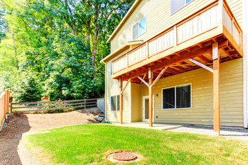 American achitecture. House with walkout basement and deck