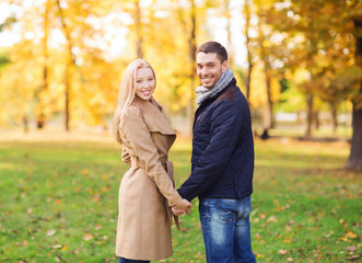 smiling couple in autumn park