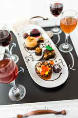 Tasting of wine and pattie chocolate pastries at the chocolate.