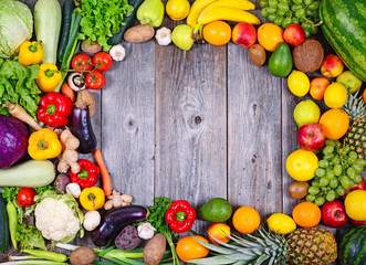 Collection of fresh Fruit and vegetables on wooden table in form