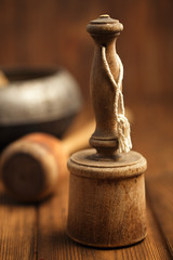 retro potato mashers on old wooden table in rustic style