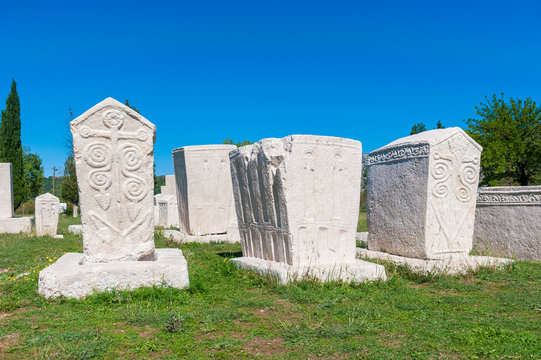 Monumental medieval tombstones lie scattered in Stolac