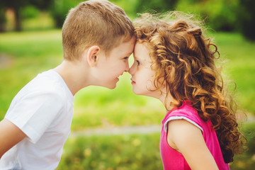 Brother and sister confronted foreheads.