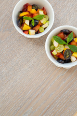 Fruit salad in white dishes