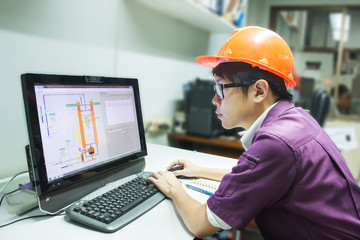 Engineer student looking simulated oil distillation in computer