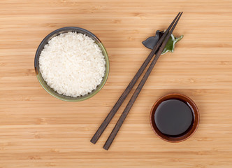 Rice bowl, chopsticks and soy sauce