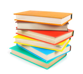 Multi-coloured books. On white background.