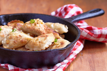 Dumplings fried with onion