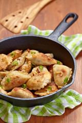 Dumplings fried with onion